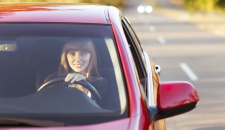 girl traveling by car smiling